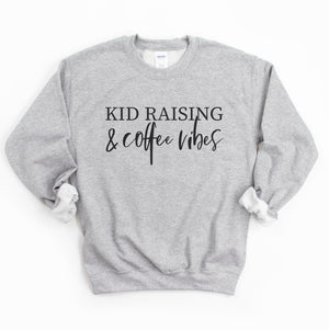 Kid Raising & Coffee Vibes - Sport Grey Unisex Fleece Pullover